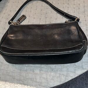 Original coach handbag. Has tan stitching
Inside zipper pocket.